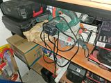 a shelf full of electronics and other items in a room
