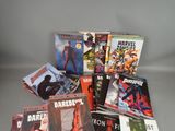 a lot of comic books that are on the table