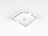 a white ashtray with chains on it on a white surface