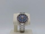 wrist watch on a display stand with a blue dial