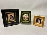 three framed pictures of a woman and a man with a cat