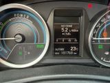 a close up of a car dashboard with various gauges