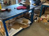 an image of a workbench in a garage with a lot of boxes on it