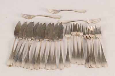 many forks and spoons laid out on the table