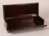 a small wooden box that is open on a white surface
