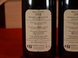 two bottles of wine that are on a table