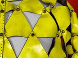 a mannequin dressed in a yellow and black outfit