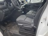 the interior of a white van with the driver ' s seat up