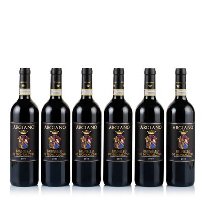 four bottles of red wine are lined up on a white surface