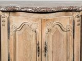 a wooden cabinet with a marble top in a room