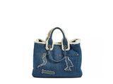 a blue denim bag with a dog embroidered on the front
