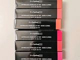 four mac lipsticks are lined up in a row on a white surface