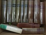a box full of books and a tube of glue in it