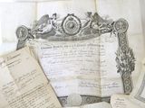 many old papers that are laying on a table