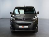 the front of a grey citrole van parked in a garage