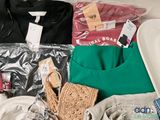many items that are packed in a bag on the bed