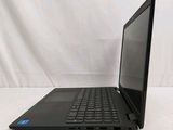 the laptop is sitting on a white surface with a black keyboard