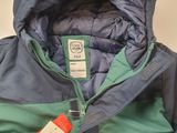 the jacket is blue and green and has a tag on it
