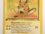 a close up of a pokemon card on a white surface