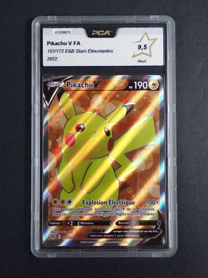 the pokemon card is in a plastic case on a black surface