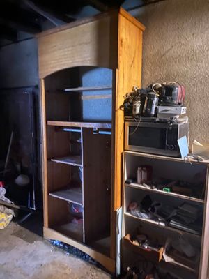 an image of a kitchen with a refrigerator and cabinets