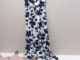 a white and blue floral dress, pink and green shirt, and blue and white shirt