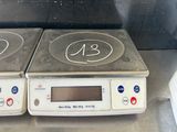 two stove top burners that have numbers on them