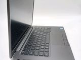 a laptop that is open on a white surface