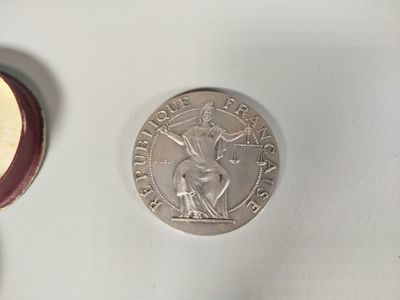 two coins on the table next to each other
