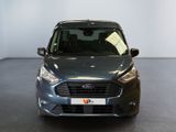 the front of a grey ford transit van parked in a showroom