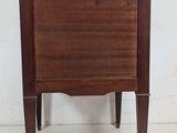 a small wooden table with a drawer on it