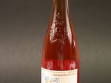 a bottle of wine that is sitting on a table