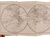 an open book with a map of the world on it