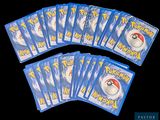several packs of pokemon trading cards are shown on a black background
