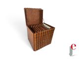 a wooden box that has a bunch of books inside of it