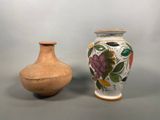 two vases sitting next to each other on a table