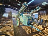 a large machine that is in the middle of a barn