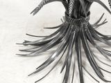 an image of a metal sculpture of a flower