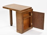 an image of a small wooden table with a door open