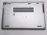a silver laptop that is sitting on a table
