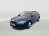 the blue car is parked in a white room with a white floor