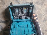 a blue tool case with tools in it on the floor