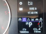 a close up of a car dashboard with a clock on it