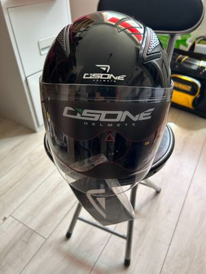 a helmet sitting on a chair in a room