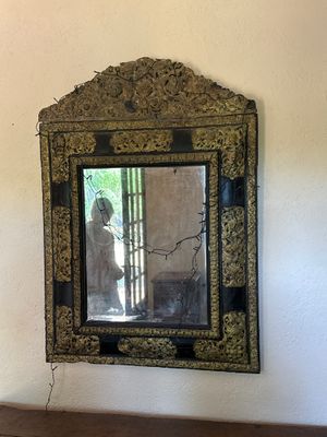 a mirror hanging on the wall in a room