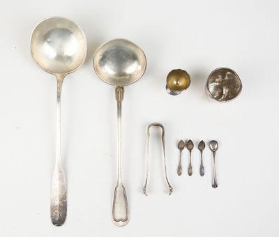 several silver spoons and spoon spoons are arranged on a white surface