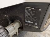 a close up of a car ' s fuel tank with a hose attached to it