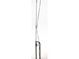 a black floor lamp with a light on top of it