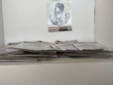 a pile of newspapers sitting on top of a table