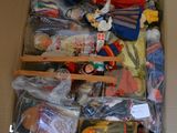 a cardboard box filled with toys and other items